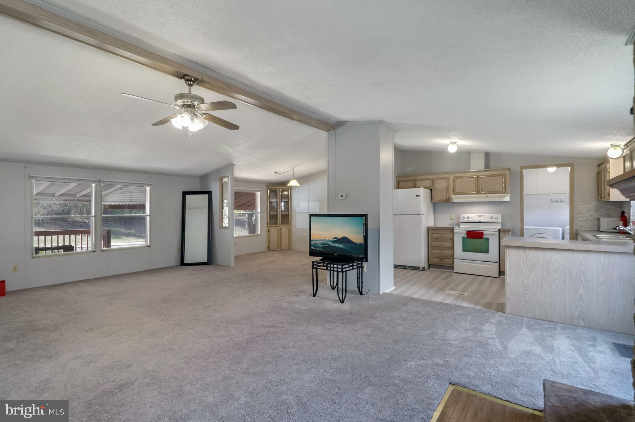 7810 Clark Road, Unit E15 Hanover, MD 21076 - Photo 5 of 20 a view of a livingroom with furniture and a kitchen