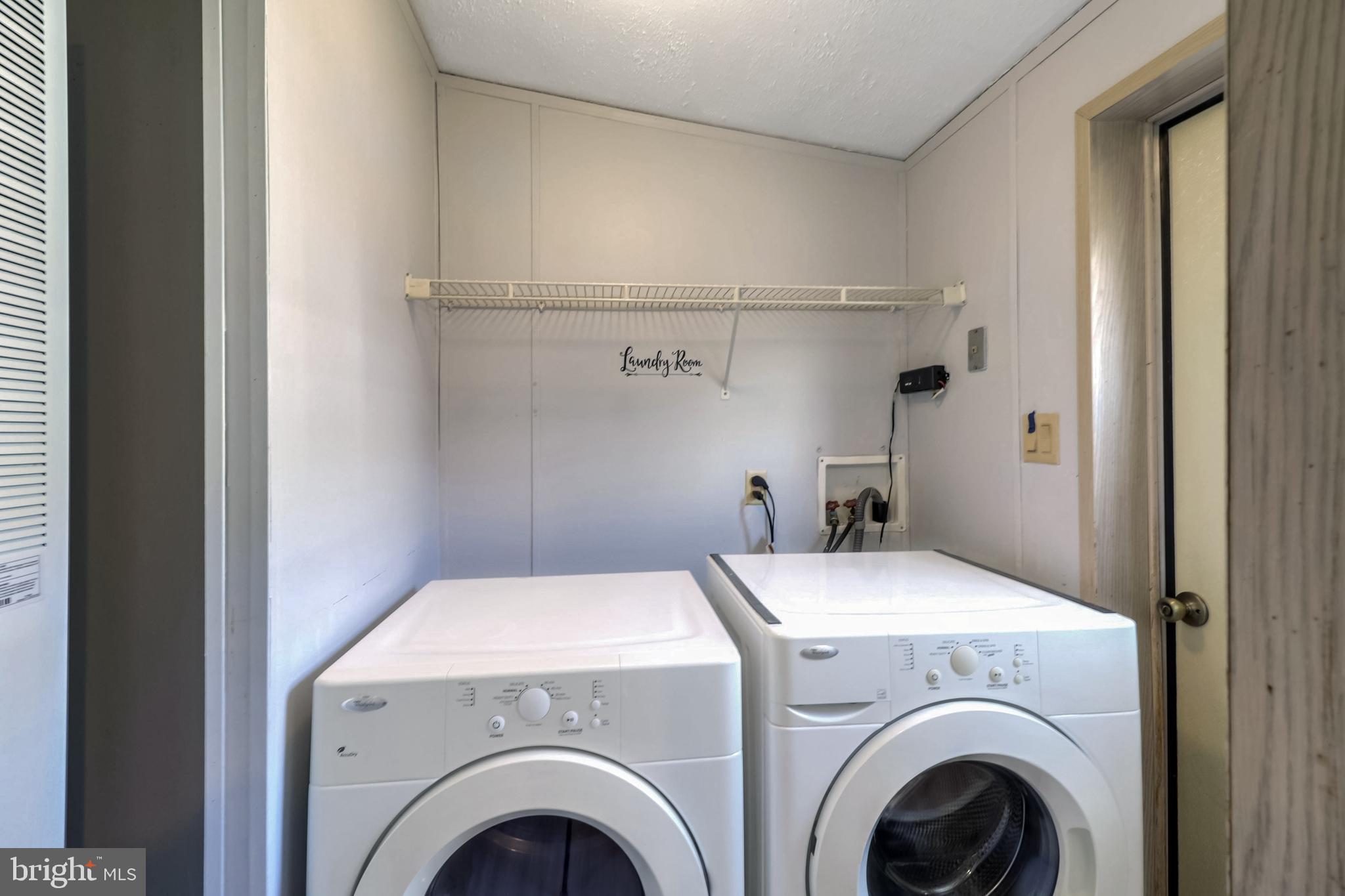 7810 Clark Road, Unit E15 Hanover, MD 21076 - Photo 8 of 20 a view of washer and dryer in a utility room