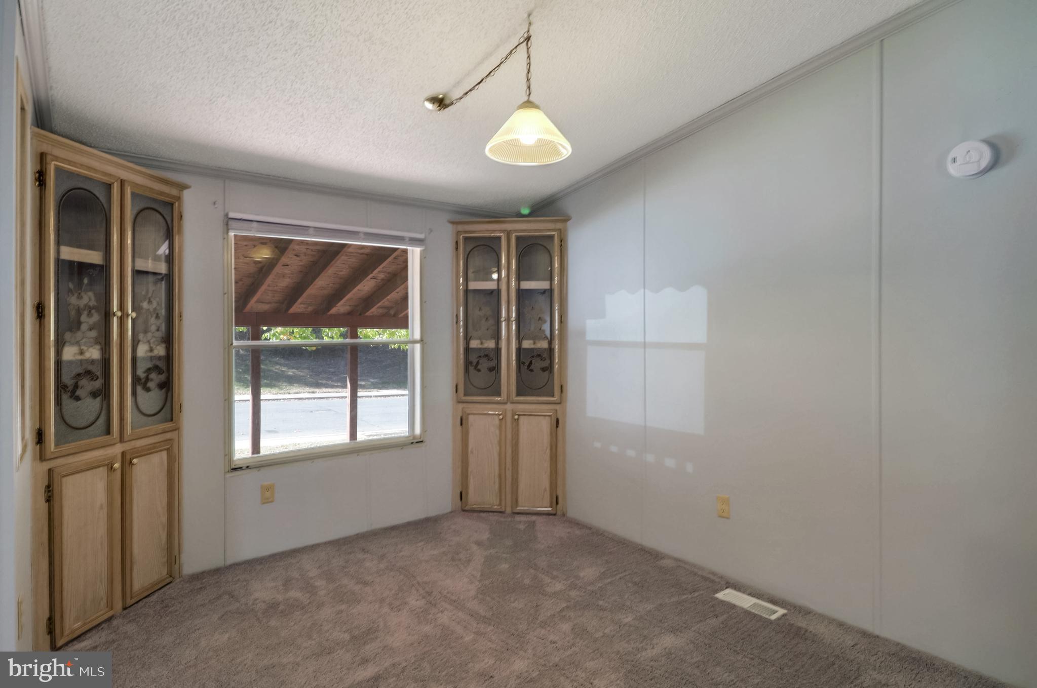 7810 Clark Road, Unit E15 Hanover, MD 21076 - Photo 9 of 20 an empty room that has a window