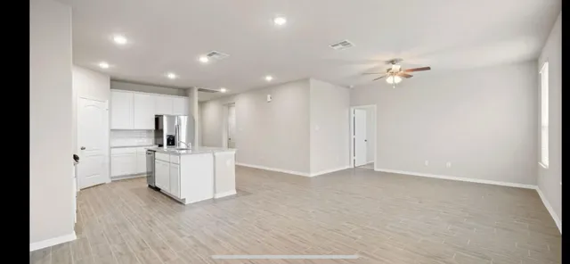 a view of kitchen with wooden floor and window
