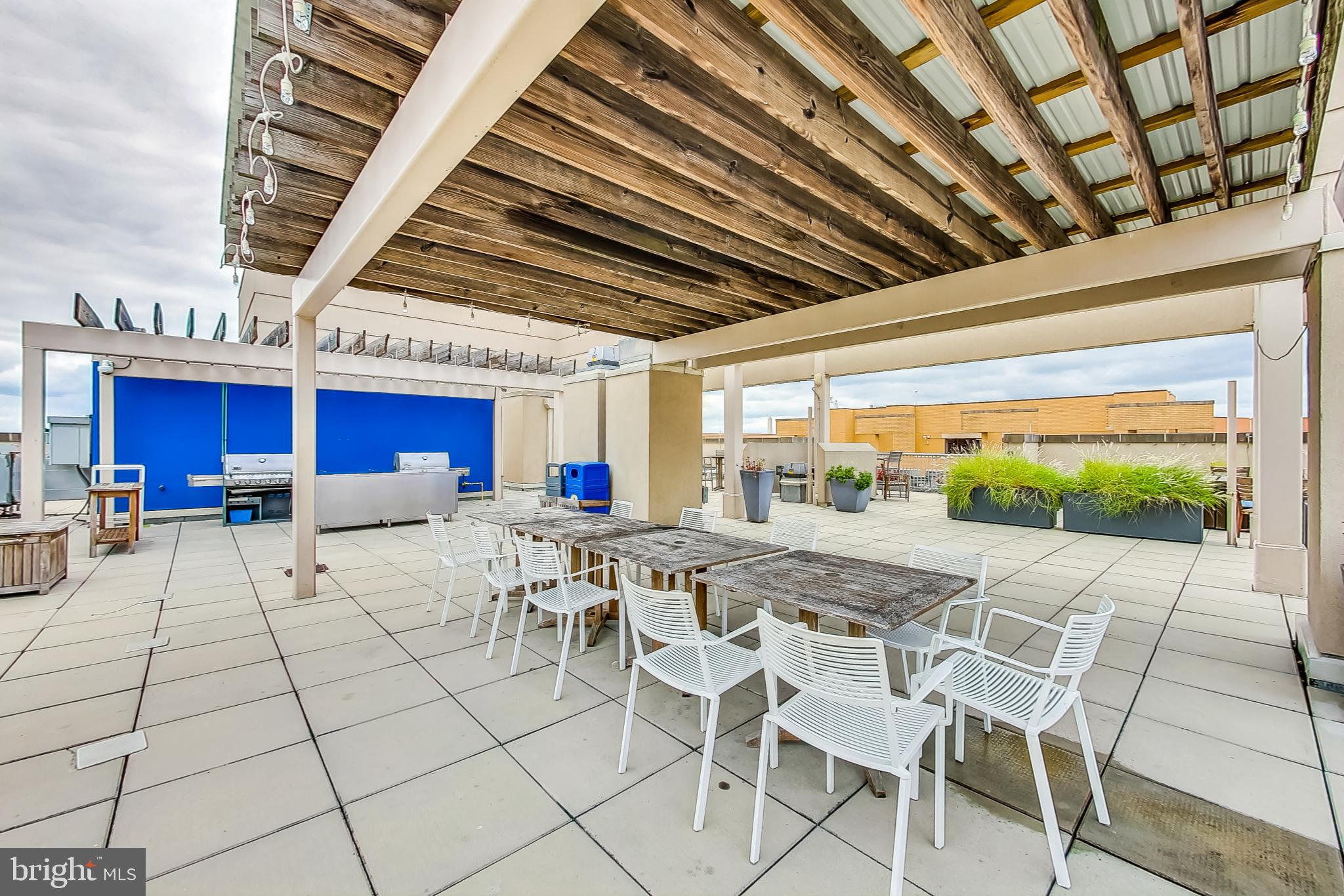 811 4th Street Northwest, Unit 112 Washington, DC 20001 - Photo 21 of 44 a view of a dining room with furniture wooden floor and a rug