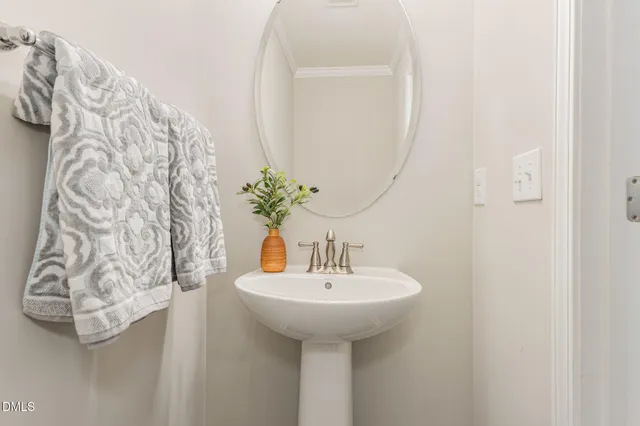 a bathroom with a sink and mirror