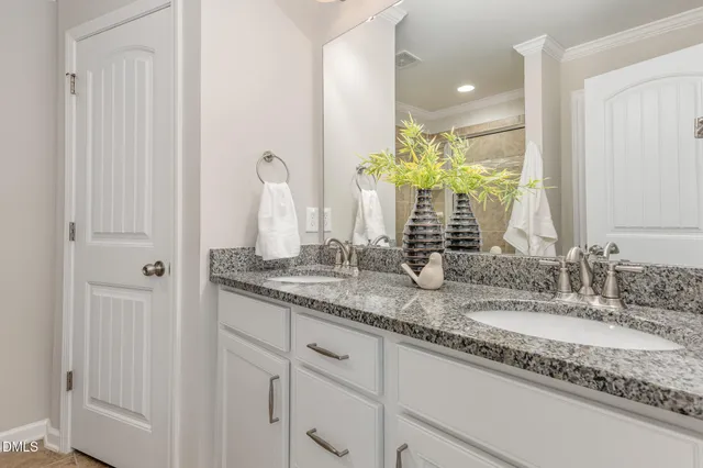 a bathroom with sinks and a vanity