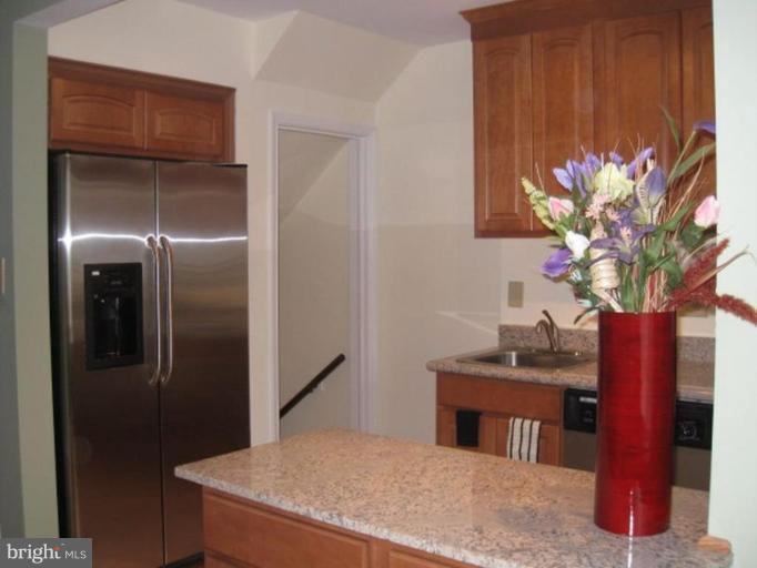230 Riverthorn Road Middle River, MD 21220 - Photo 3 of 27 a vase of flowers sitting on a table