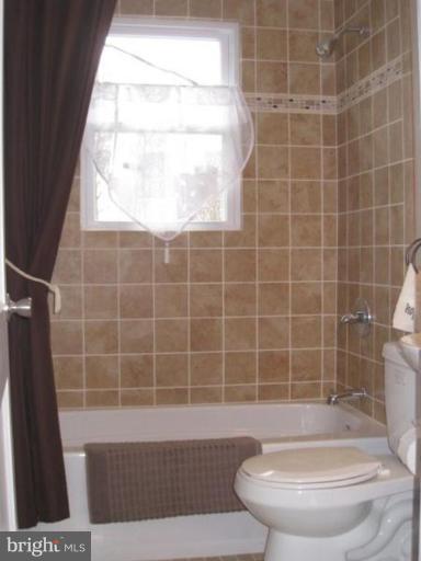 230 Riverthorn Road Middle River, MD 21220 - Photo 7 of 27 a bathroom with a black white checkered floor