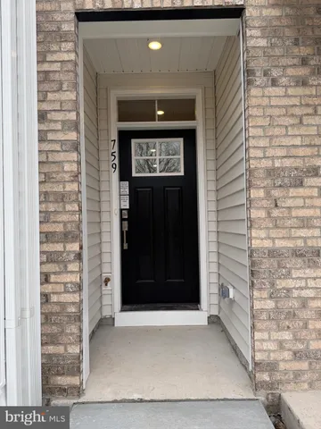 a front view of a house with a white door