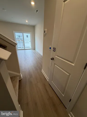 a view of entryway with wooden floor