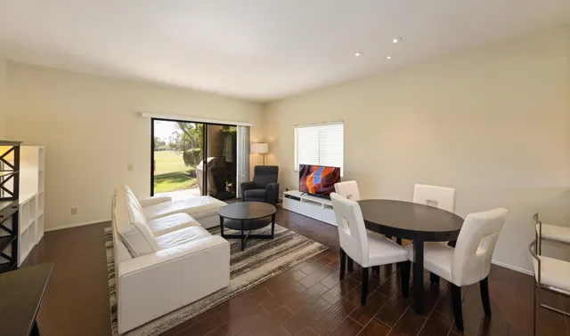 a living room with furniture and a table