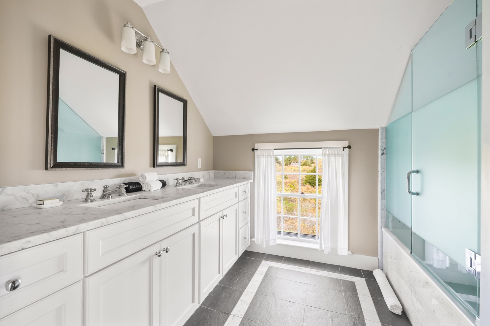 21 Quidnet Road Nantucket, MA 02554 - Photo 47 of 62 a bathroom with a double vanity sink and a mirror
