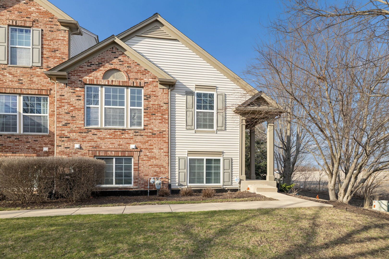 460 Valentine Way Oswego, IL 60543 - Photo 1 of 23 a front view of a house with a yard