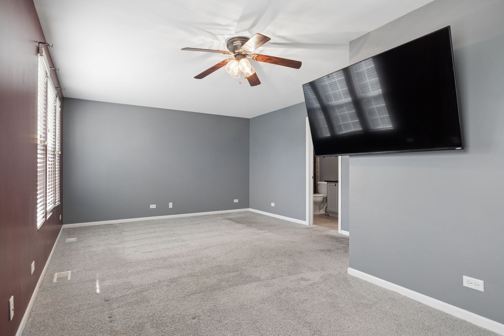 460 Valentine Way Oswego, IL 60543 - Photo 11 of 23 a view of an empty room with wooden floor and a window