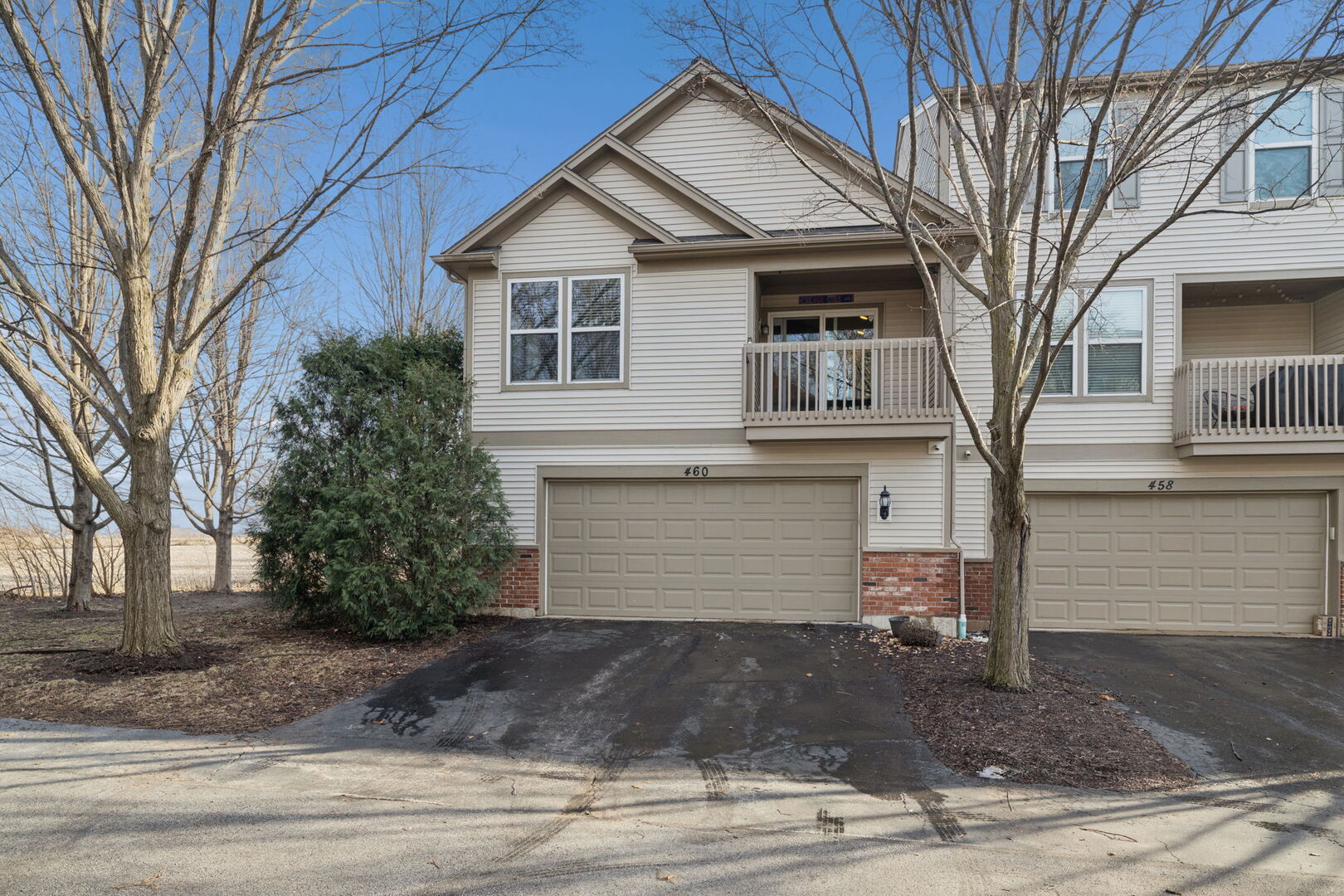 460 Valentine Way Oswego, IL 60543 - Photo 3 of 23 a front view of a house with a yard and garage