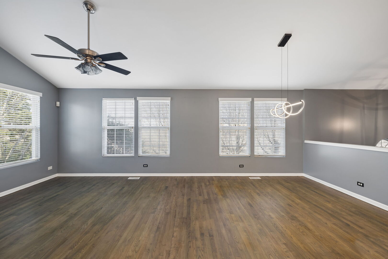 460 Valentine Way Oswego, IL 60543 - Photo 6 of 23 a view of an empty room with wooden floor and a window