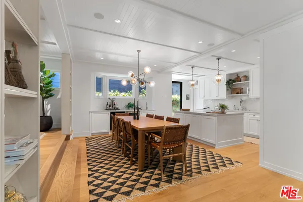 a kitchen with cabinets and stainless steel appliances