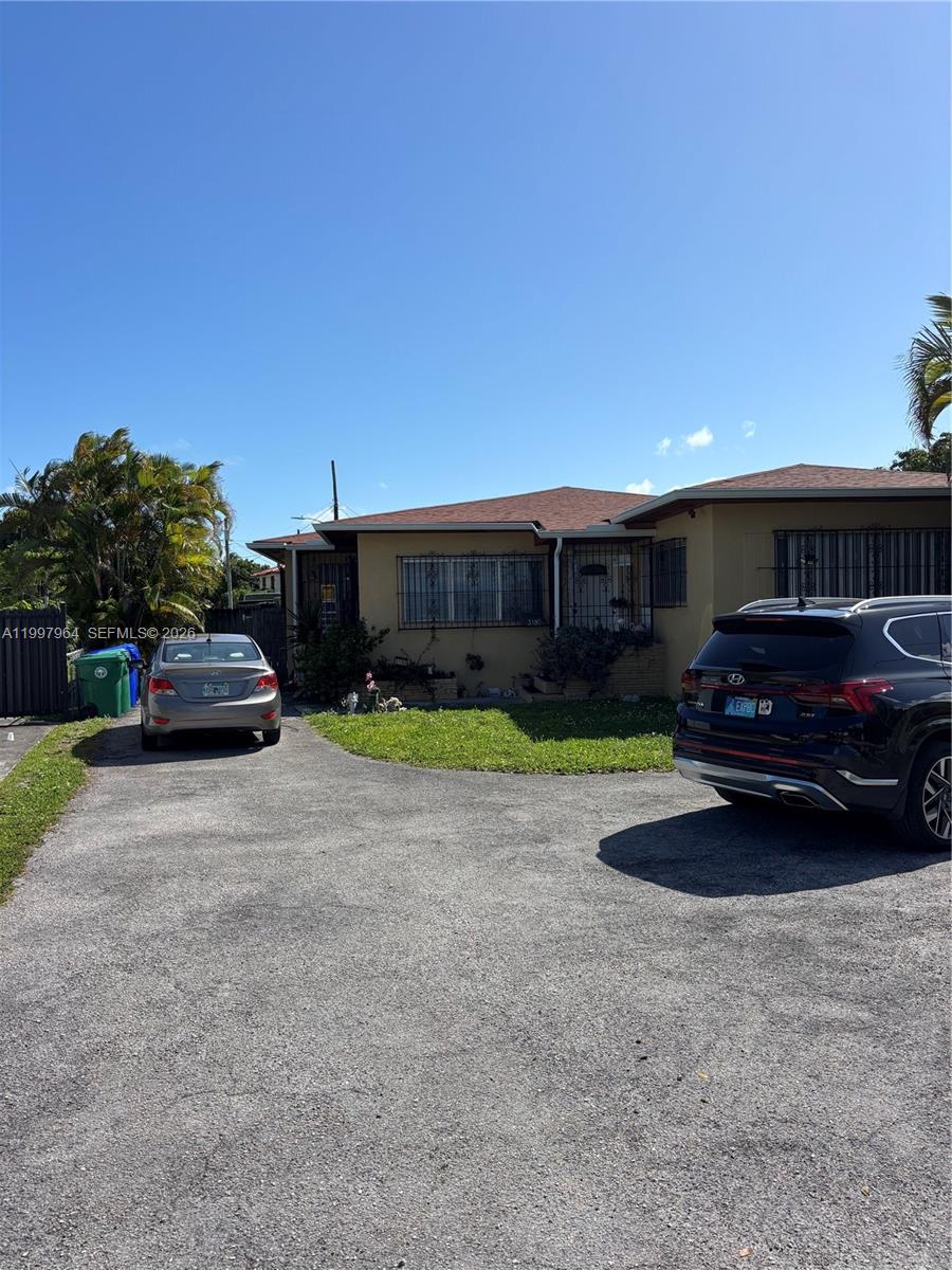 3180 Southwest 26th Street Miami, FL 33133 - Photo 2 of 7 a car parked in front of a house