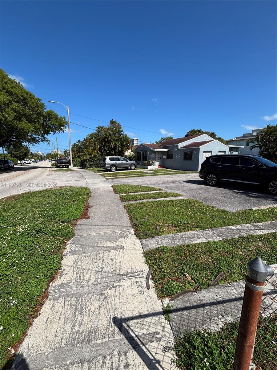3180 Southwest 26th Street Miami, FL 33133 - Photo 4 of 7 a view of a yard with cars parked