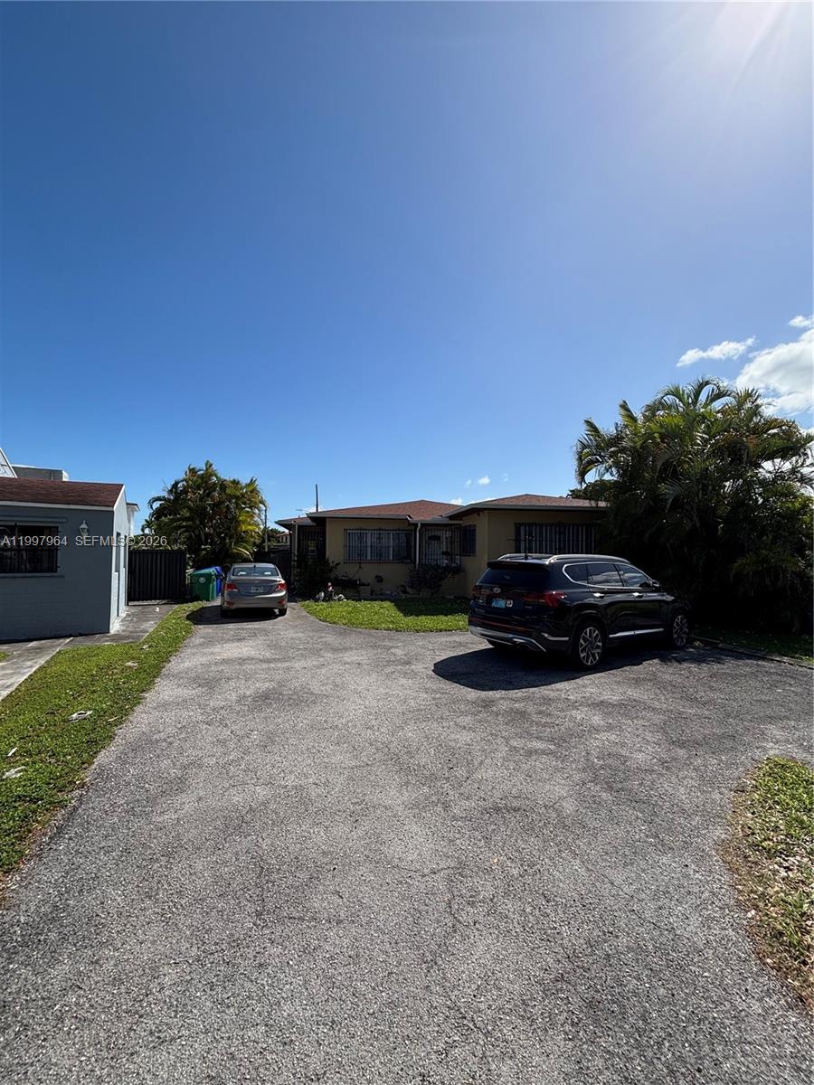 3180 Southwest 26th Street Miami, FL 33133 - Photo 5 of 7 a view of backyard with parked car