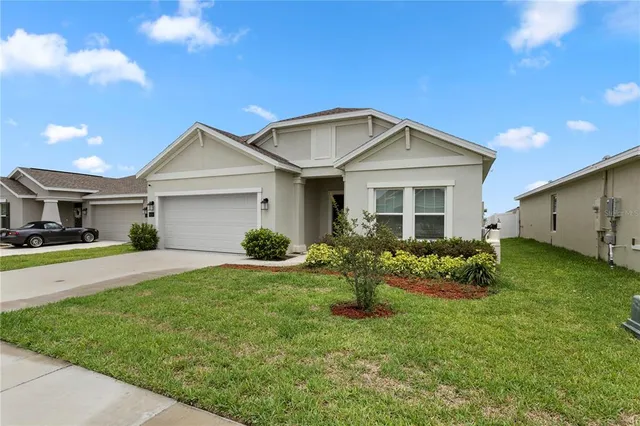 a front view of house with yard and green space