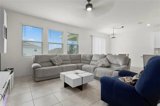 a living room with furniture and a window