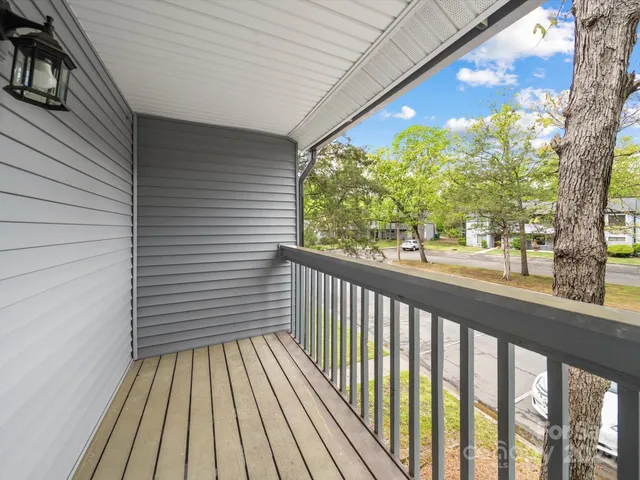 a bathroom with a bathtub sink vanity and mirror