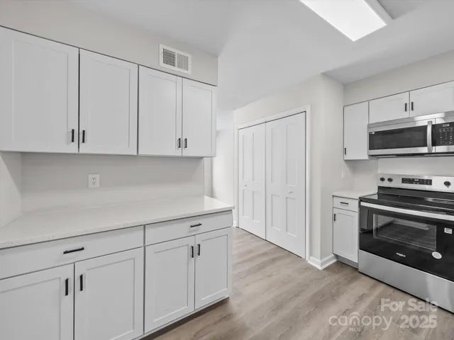 a view of staircase with wooden floor and entryway