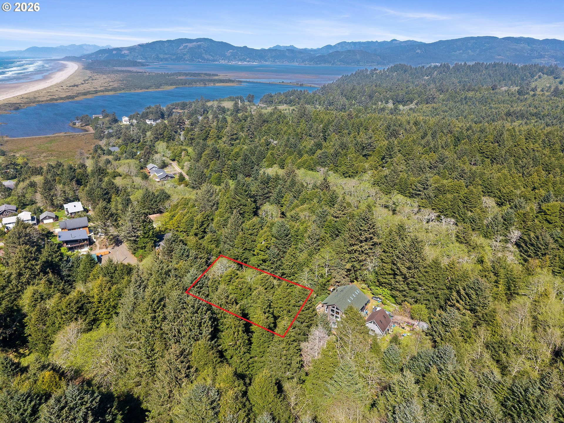 7th Street Northwest, Unit 11300 Tillamook, OR 97141 - Photo 4 of 13 a view of a forest with a mountain