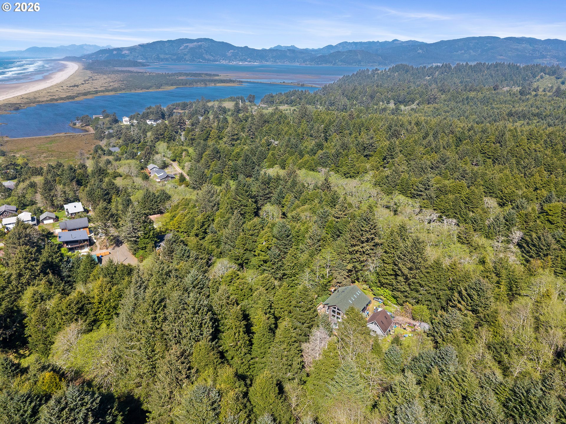 7th Street Northwest, Unit 11300 Tillamook, OR 97141 - Photo 7 of 13 a view of a city with mountains in the background