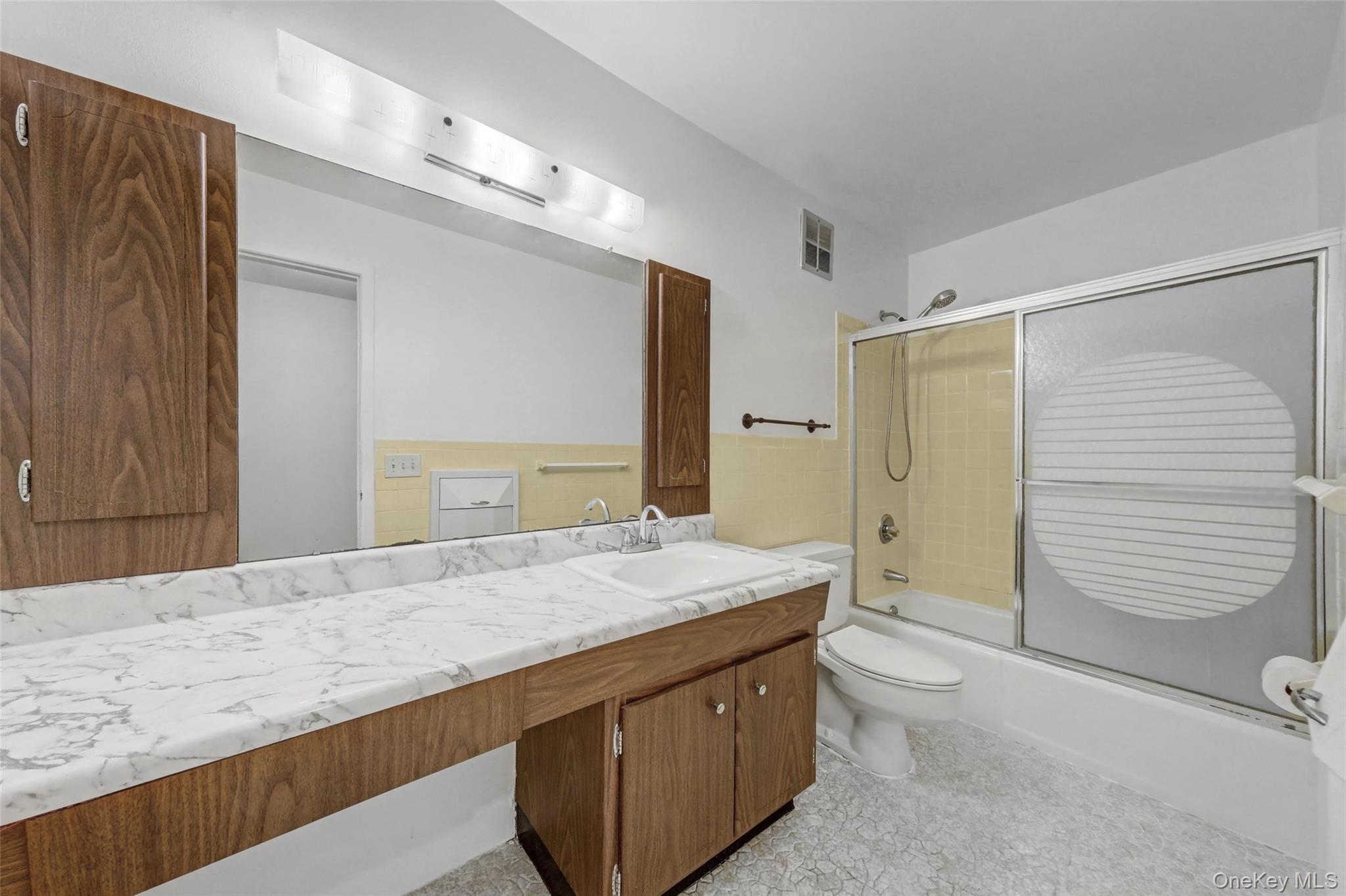 1840 Crompond Road, Unit 2A3 Peekskill, NY 10566 - Photo 14 of 22 a bathroom with a granite countertop sink toilet and shower