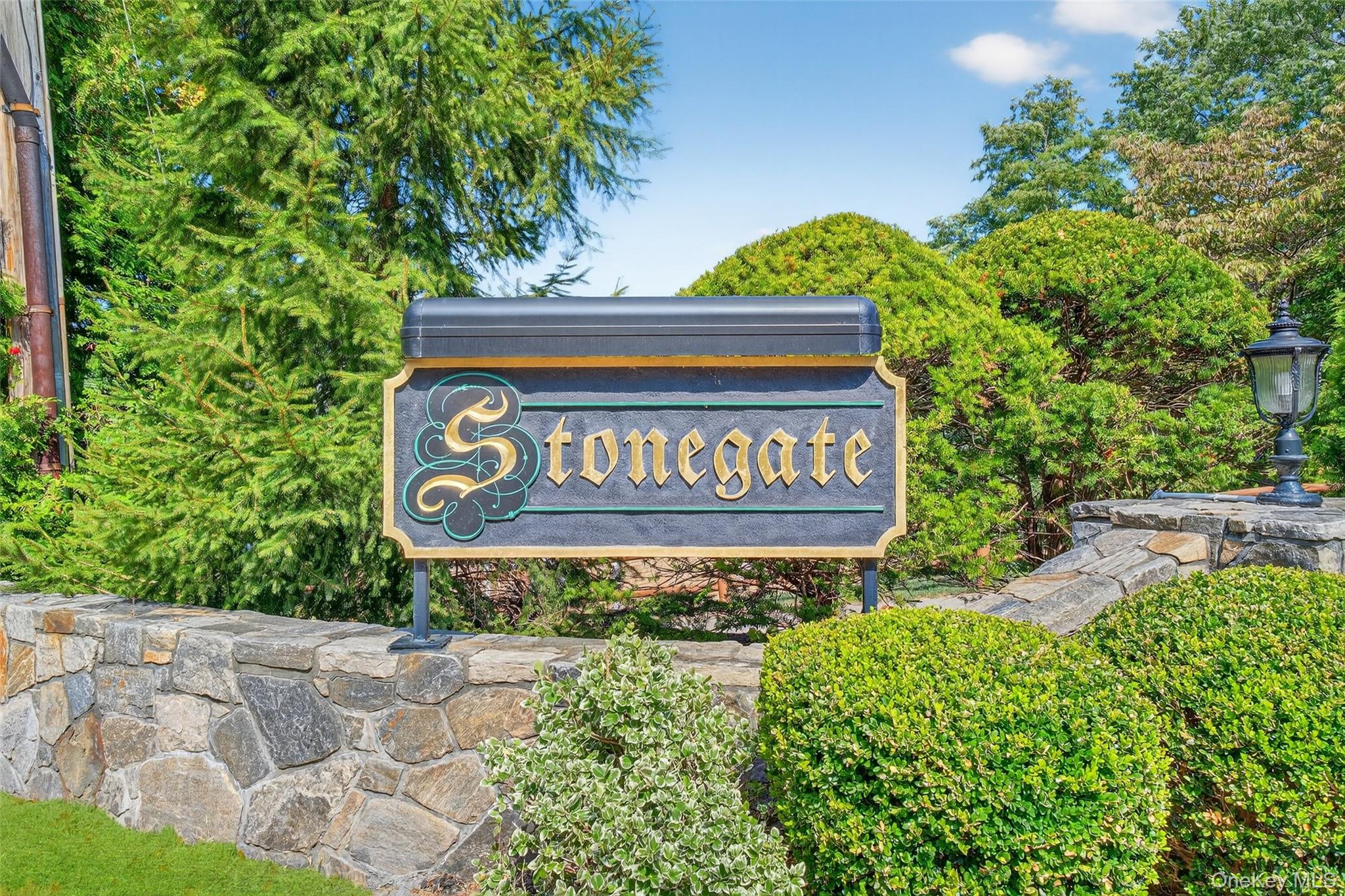 1840 Crompond Road, Unit 2A3 Peekskill, NY 10566 - Photo 2 of 22 a sign that is sitting on a brick wall