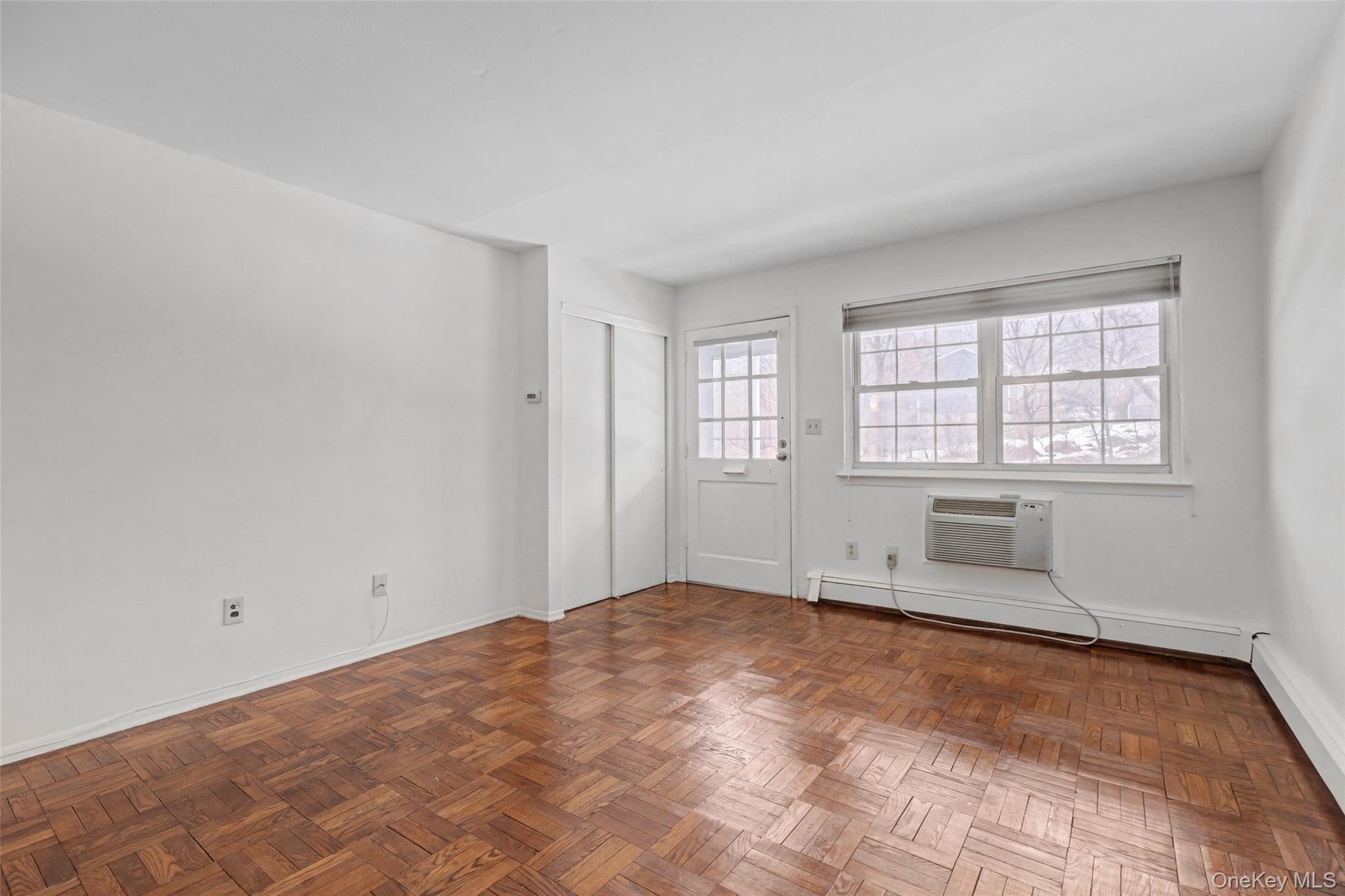 1840 Crompond Road, Unit 2A3 Peekskill, NY 10566 - Photo 6 of 22 an empty room with windows