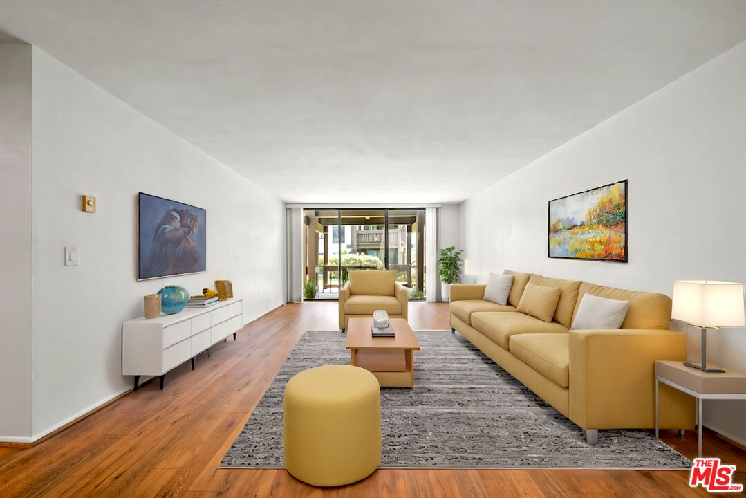 7765 West 91st Street, Unit F1110 Playa del Rey, CA 90293 - Photo 1 of 22 a living room with furniture and a large window