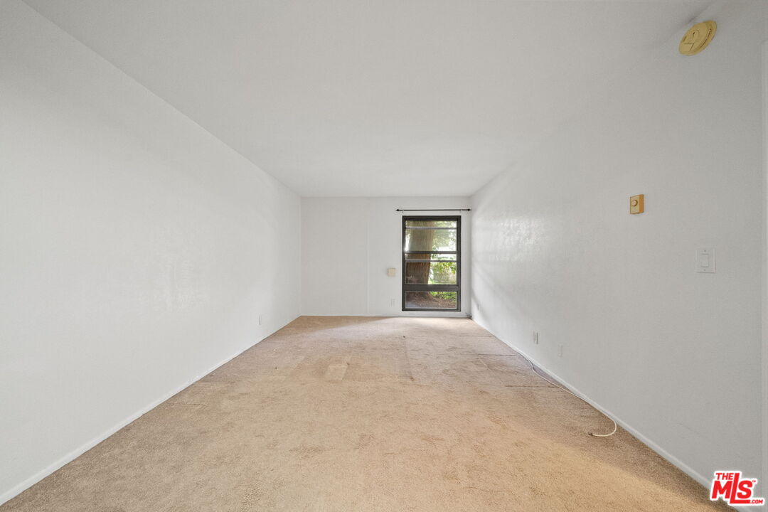 7765 West 91st Street, Unit F1110 Playa del Rey, CA 90293 - Photo 12 of 22 a view of an empty room and window