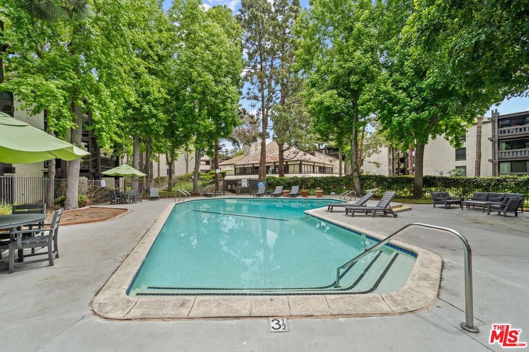 7765 West 91st Street, Unit F1110 Playa del Rey, CA 90293 - Photo 15 of 22 a view of a swimming pool with chairs