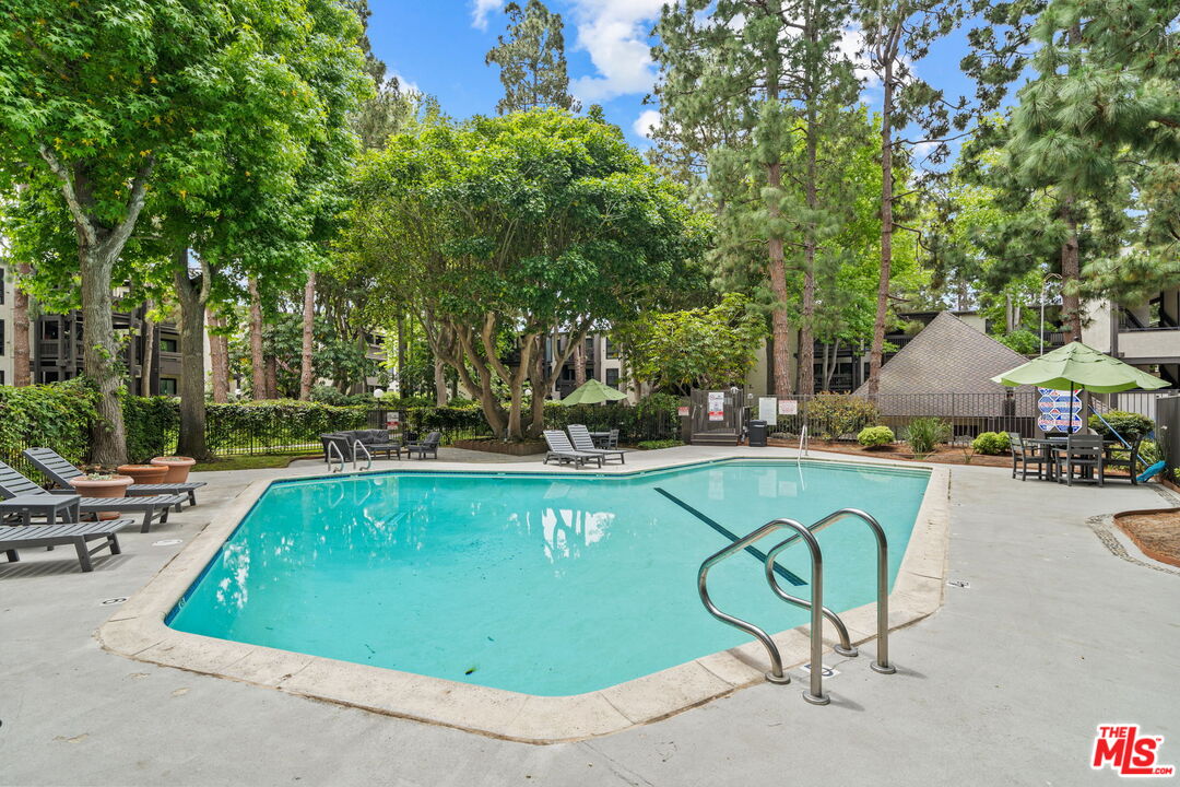 7765 West 91st Street, Unit F1110 Playa del Rey, CA 90293 - Photo 16 of 22 a view of swimming pool with chairs