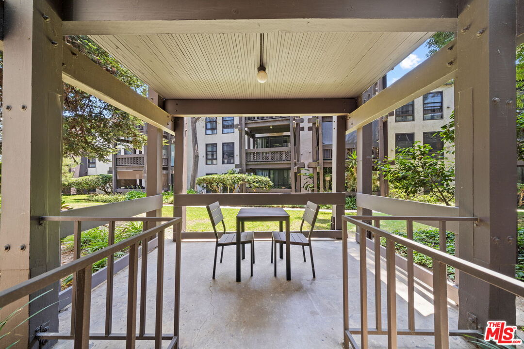 7765 West 91st Street, Unit F1110 Playa del Rey, CA 90293 - Photo 4 of 22 a view of an chairs and table in the balcony