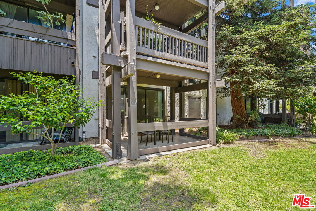7765 West 91st Street, Unit F1110 Playa del Rey, CA 90293 - Photo 5 of 22 a view of a house with a yard and plants
