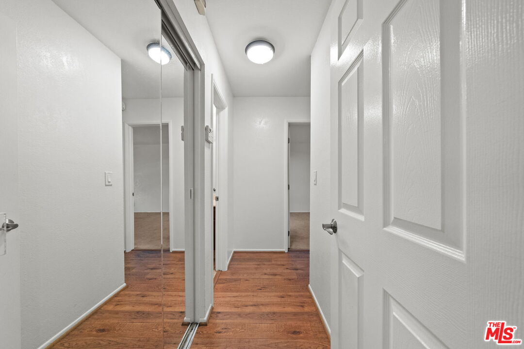 7765 West 91st Street, Unit F1110 Playa del Rey, CA 90293 - Photo 7 of 22 a view of a hallway with wooden floor