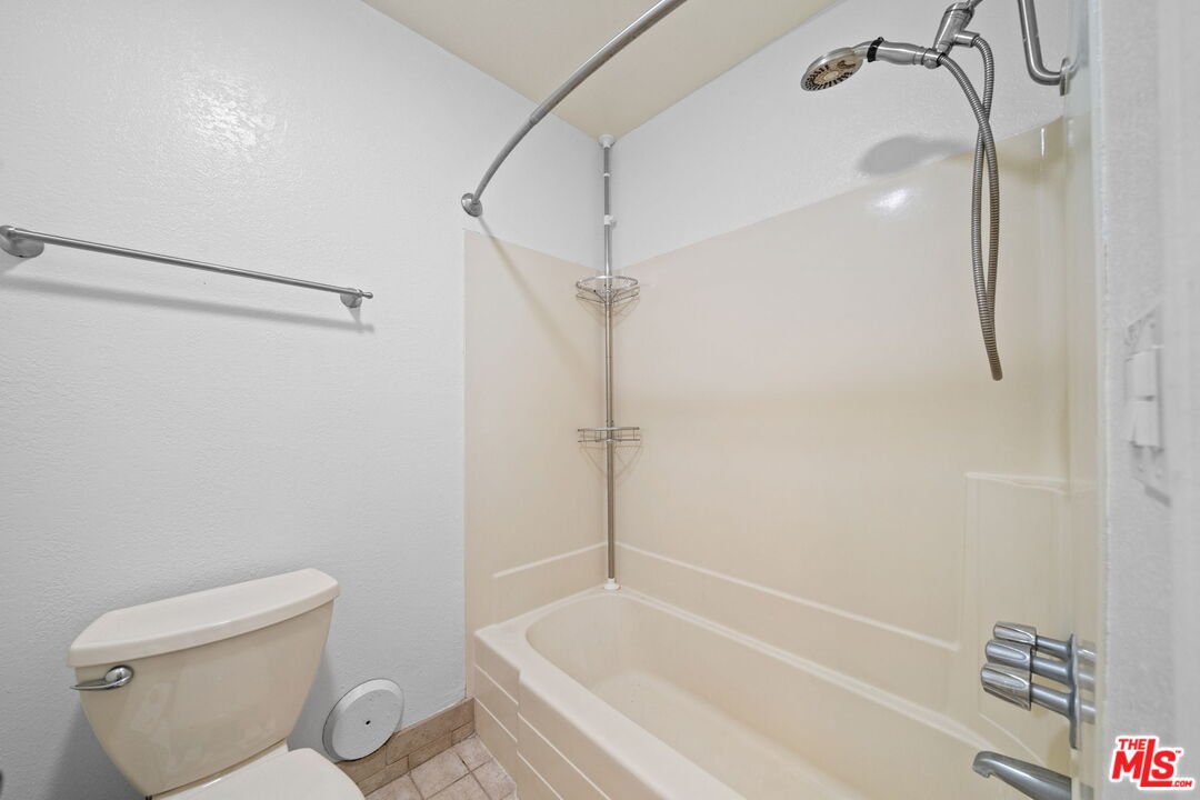 7765 West 91st Street, Unit F1110 Playa del Rey, CA 90293 - Photo 10 of 22 a bathroom with a shower a toilet and a shower