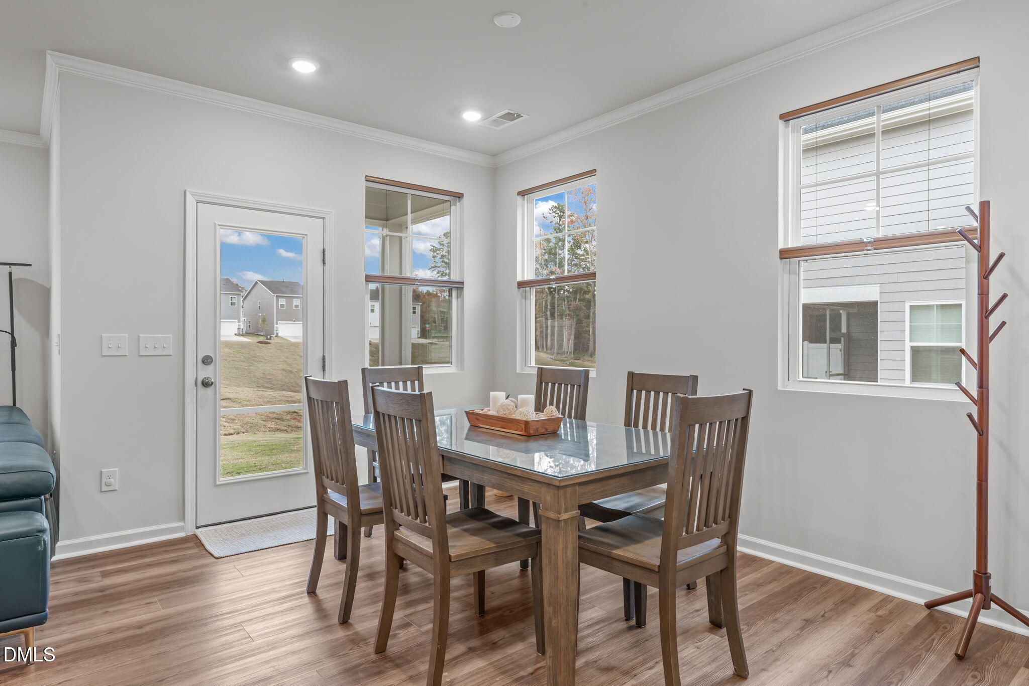 1809 Barrett Run Trail Apex, NC 27502 - Photo 12 of 37 a view of a dining room with furniture window and wooden floor