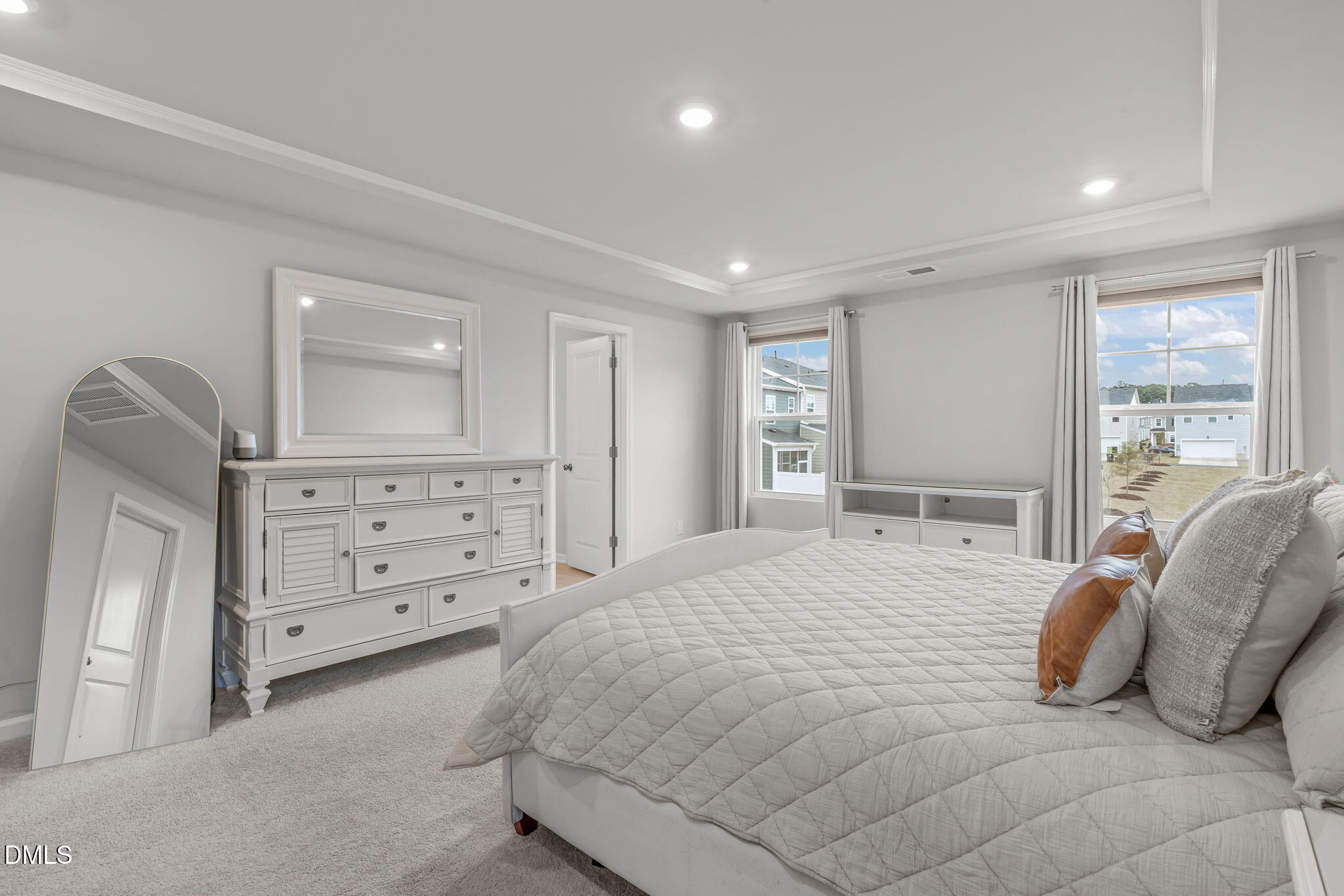 1809 Barrett Run Trail Apex, NC 27502 - Photo 19 of 37 a bedroom with a bed and a dresser