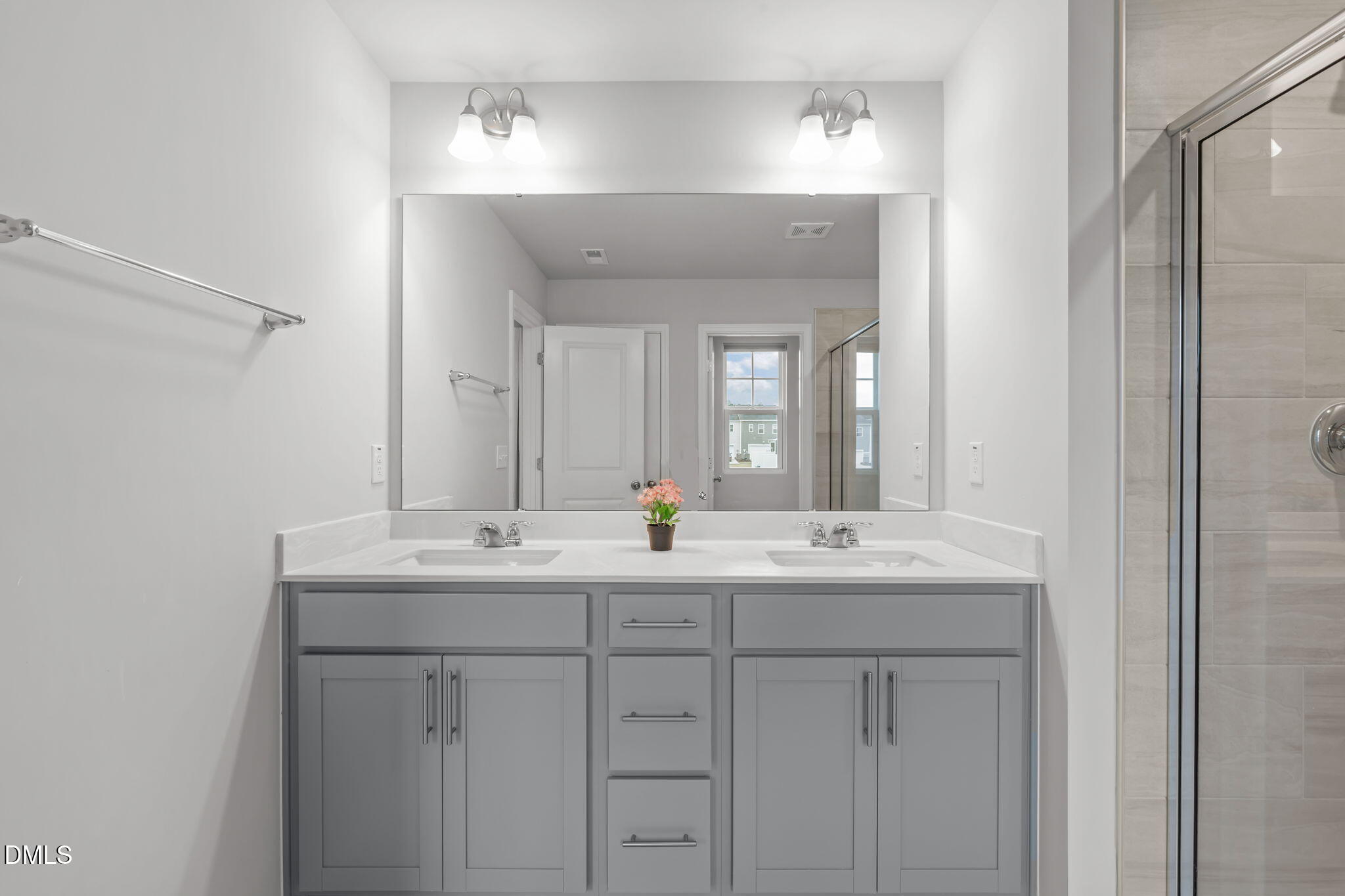 1809 Barrett Run Trail Apex, NC 27502 - Photo 23 of 37 a bathroom with double sink and a mirror