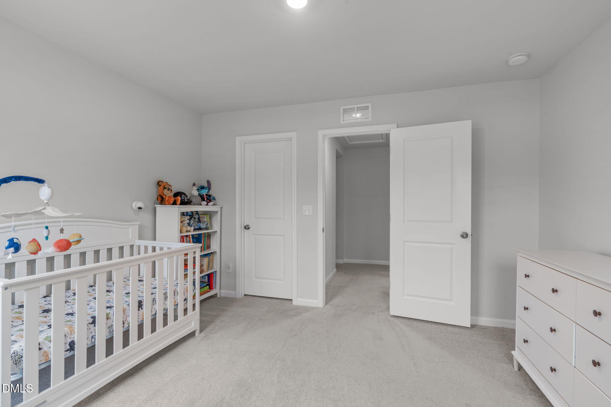 1809 Barrett Run Trail Apex, NC 27502 - Photo 25 of 37 a bedroom with baby crib and baby crib