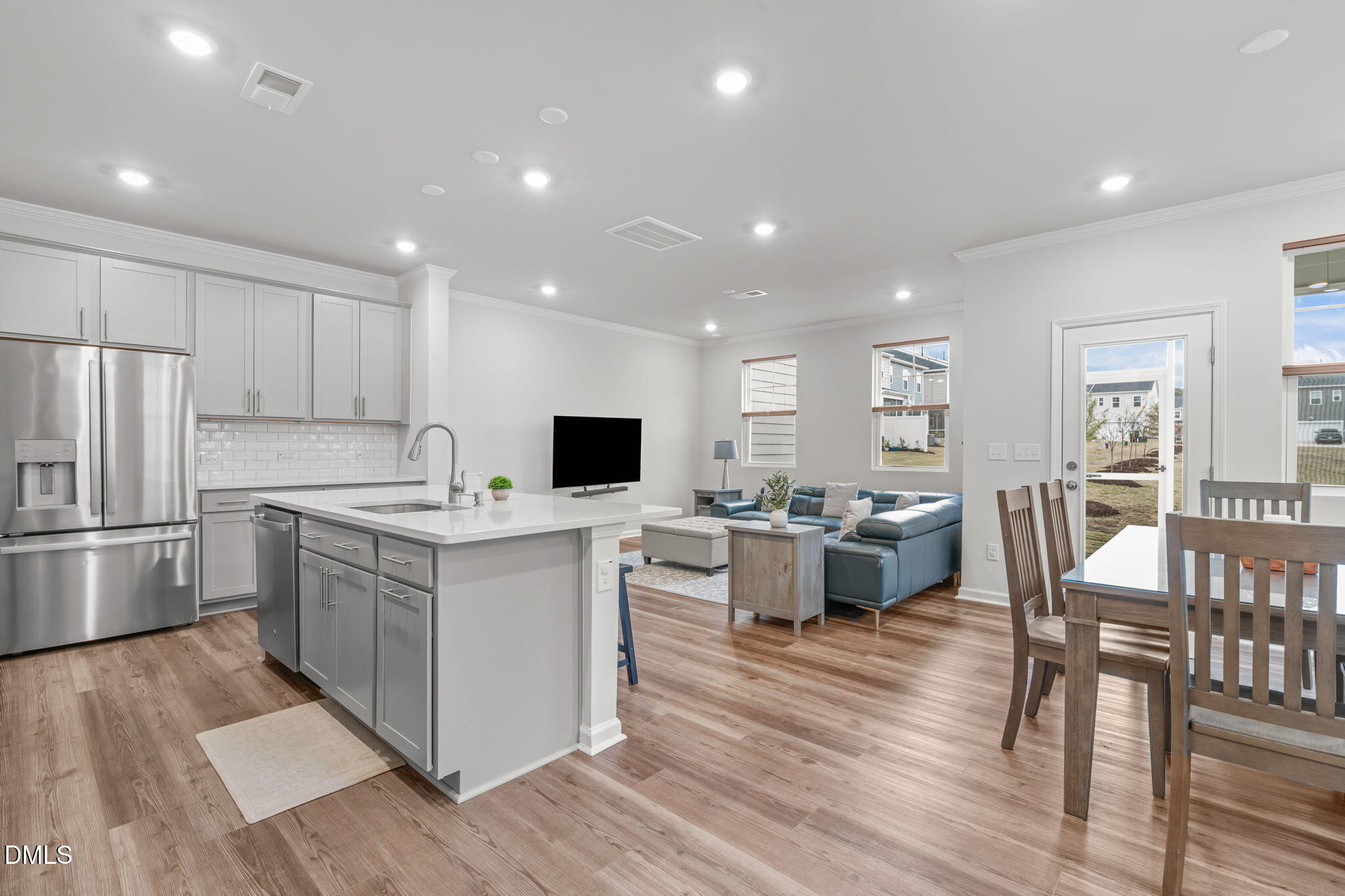 1809 Barrett Run Trail Apex, NC 27502 - Photo 5 of 37 a kitchen with a sink cabinets and refrigerator