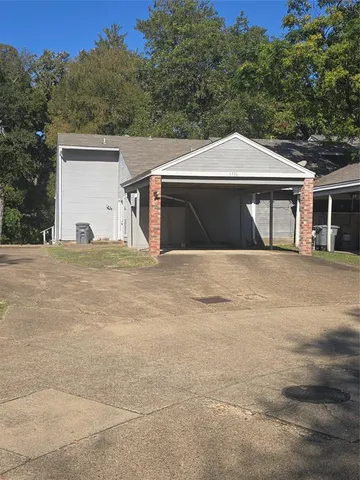 a front view of a house with a outdoor space
