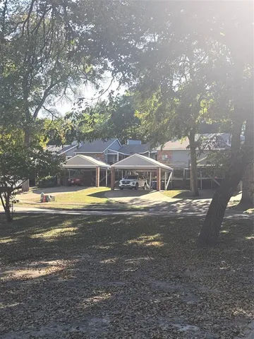 a view of a swimming pool with an outdoor space and seating area