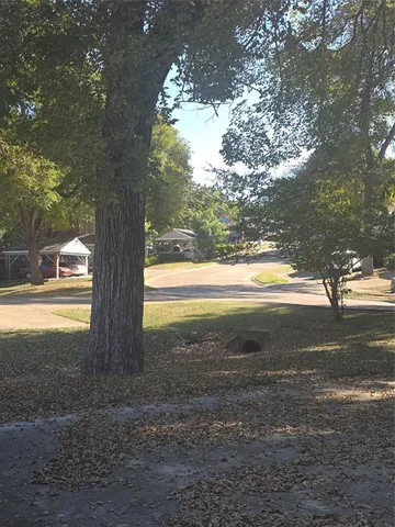 a view of a house with large windows