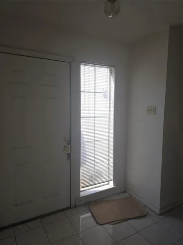 a living room with a couch and a fireplace