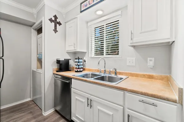 a kitchen with a sink and cabinets