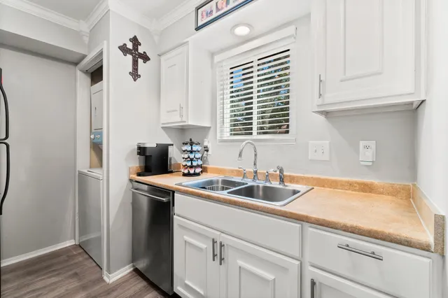 a kitchen with a sink and cabinets