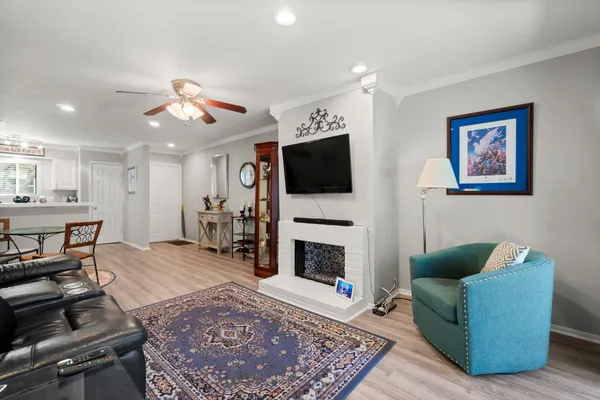 a living room with furniture and a fireplace